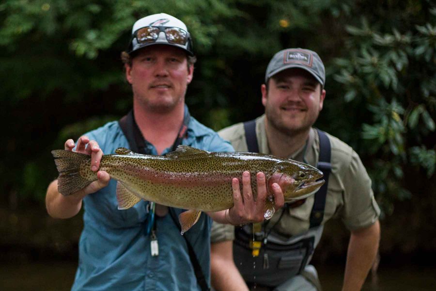 Hunter Morris and a guided client with a large rainbow trout