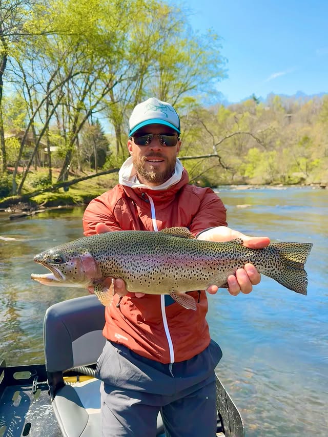Angler with trophy rainbow trout on a North Georgia river